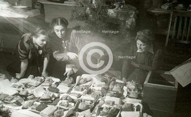 Actresses of the Moscow Art Theatre preparing presents for the Red Army, USSR, 1943. Artist: Anon