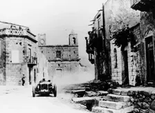 Achille Varzi in a P2 Alfa Romeo Grand Prix car, in the Targa Florio race, Sicily, 1930