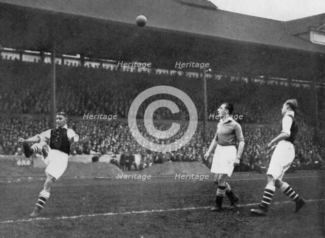 Acrobatics in a Arsenal v Chelsea match at Stamford Bridge, London, c1933-c1938. Artist: Sport & General