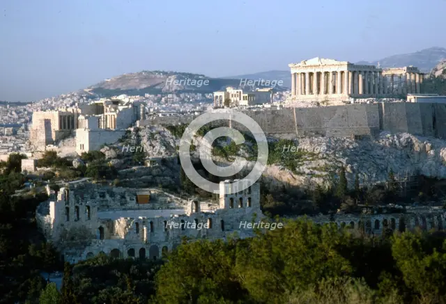 Acropolis and Theatre of Herodes Atticus, Athens from Philopappos Hill at dusk, c20th century. Artist: Unknown.