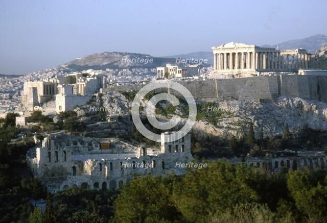 Acropolis and Theatre of Herodes Atticus, Athens from Philopappos Hill at dusk, c20th century. Artist: Unknown.