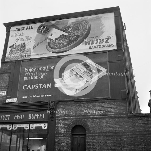 Advertising hoardings, Fortnam Road, Holloway, London, 1960-1965. Artist: John Gay