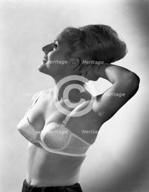 Advertising image for Truline bras, 1963.  Artist: Michael Walters