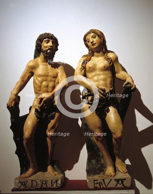 'Adam and Eve', polychromed stone carving.