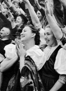 Admiring crowd saluting German Nazi leader Adolf Hitler, 1938