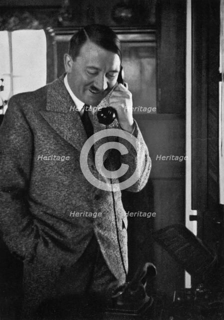 Adolf Hitler on the telephone, January 1935. Artist: Unknown