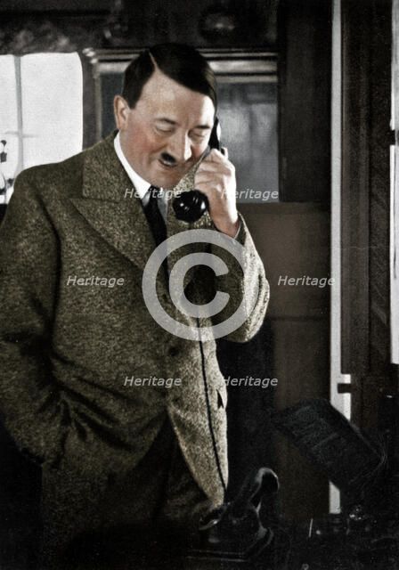 Adolf Hitler on the telephone, January 1935. Artist: Unknown.