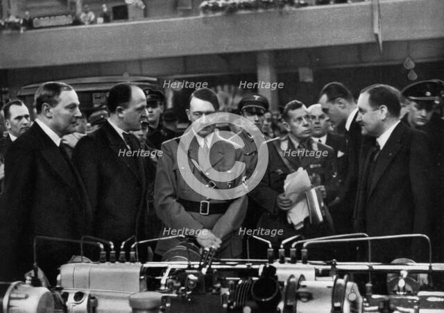 Adolf Hitler at a car show in Berlin, Germany, 1935. Artist: Unknown