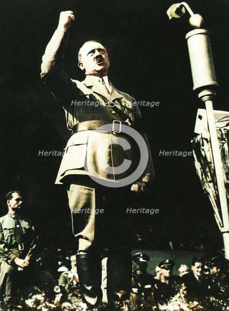 Adolf Hitler addressing a Nazi rally at Nuremberg, Germany, 1930s.  Creator: Unknown.