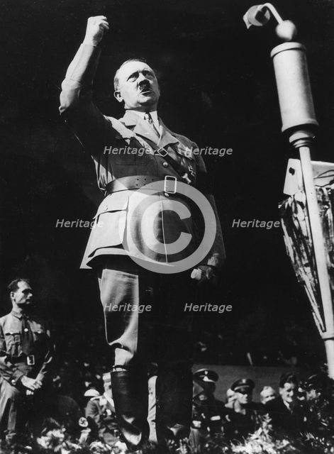 Adolf Hitler addressing a Nazi rally at Nuremberg, Germany, 1930s. Artist: Unknown