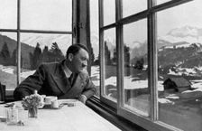 Adolf Hitler admiring the view out a window near Garmisch, Bavaria, Germany, 1936