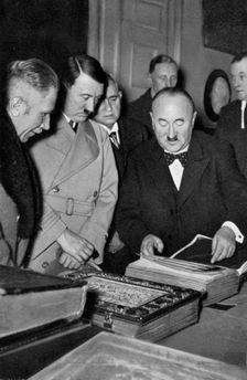 Adolf Hitler being shown the treasures of the Bavarian State Library, Germany, 1936