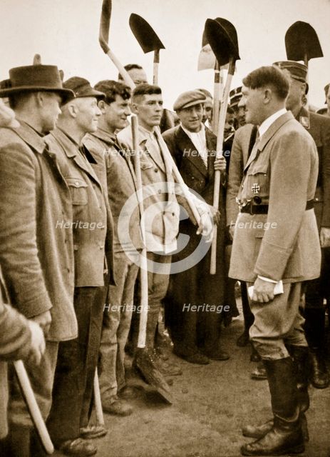Adolf Hitler chatting to road workers, 1936 Creator: Unknown.
