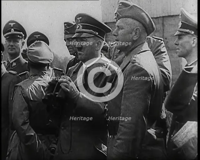 Adolf Hitler Holding a Pair of Binoculars and Standing With a Group of German Military Officers,1939 Creator: British Pathe Ltd.