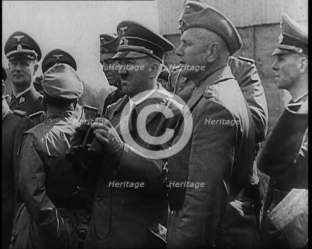 Adolf Hitler Holding a Pair of Binoculars and Standing With a Group of German Military Officers,1939 Creator: British Pathe Ltd.