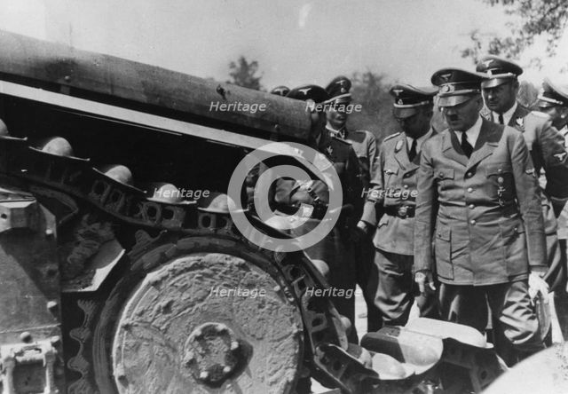 Adolf Hitler inspecting a destroyed French tank, France, World War II, 1940. Artist: Unknown