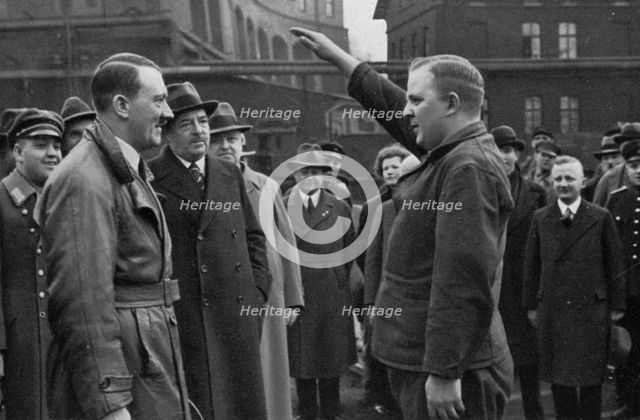 Adolf Hitler saluted by a representative of the staff of a factory, Germany, 1936. Artist: Unknown