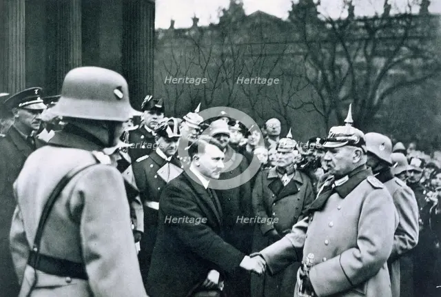 Adolf Hitler shaking hands with President von Hindenburg on the State Day of Honour, 1934. Creator: Unknown.