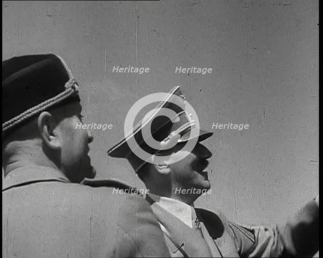 Adolf Hitler, the German Leader, and Benito Mussolini, the Italian Leader, talking, 1937. Creator: British Pathe Ltd.