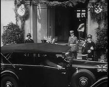 Adolf Hitler, the German Leader Coming Out of a Building in Bad Godesburg With Male German..., 1938. Creator: British Pathe Ltd