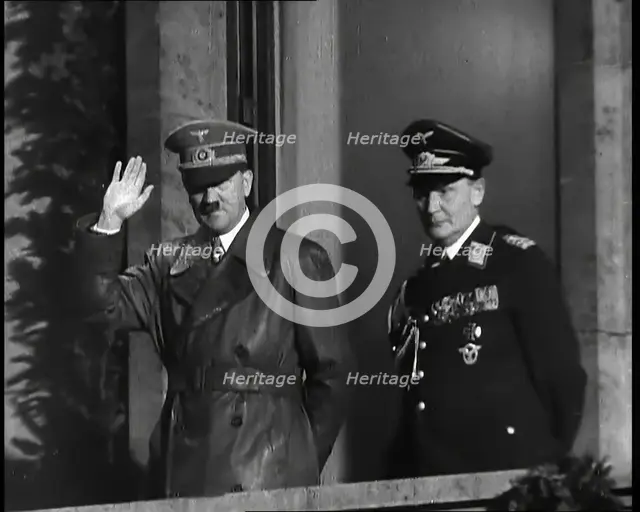 Adolf Hitler, the German Leader, Saluting the Crowd with Hermann Goering on the...,1937 Creator: British Pathe Ltd.
