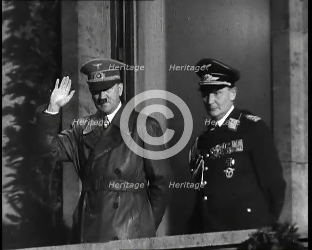 Adolf Hitler, the German Leader, Saluting the Crowd with Hermann Goering on the...,1937 Creator: British Pathe Ltd.