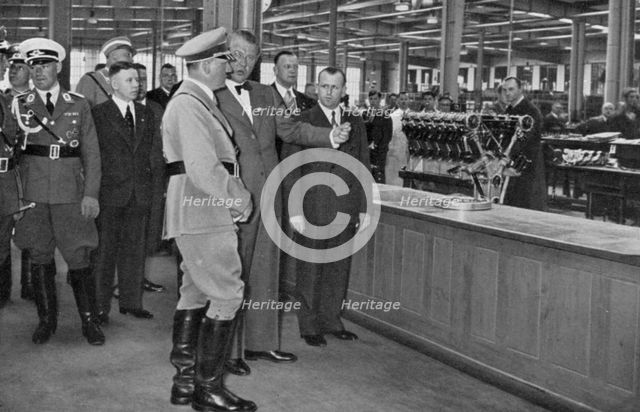 Adolf Hitler visiting a Bavarian engine works, Germany, 1936. Artist: Unknown