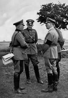 Adolf Hitler with senior German army officers, Munster training area, Germany, 1935