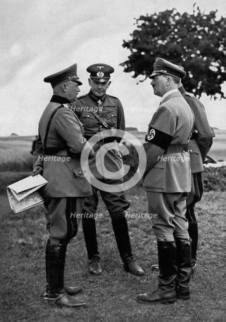 Adolf Hitler with senior German army officers, Munster training area, Germany, 1935. Artist: Unknown