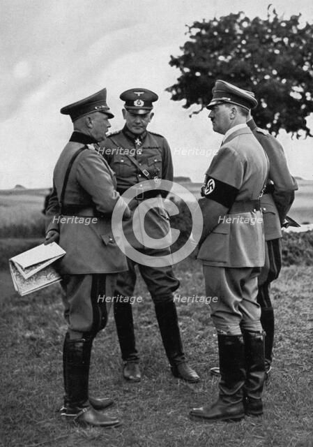 Adolf Hitler with senior German army officers, Munster training area, Germany, 1935. Artist: Unknown