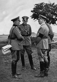 Adolf Hitler with senior German army officers, Munster training area, Germany, 1935