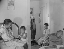 Adopted daughter and two grandchildren with Mrs. Ella Watson...charwoman, Washington, D.C, 1942. Creator: Gordon Parks