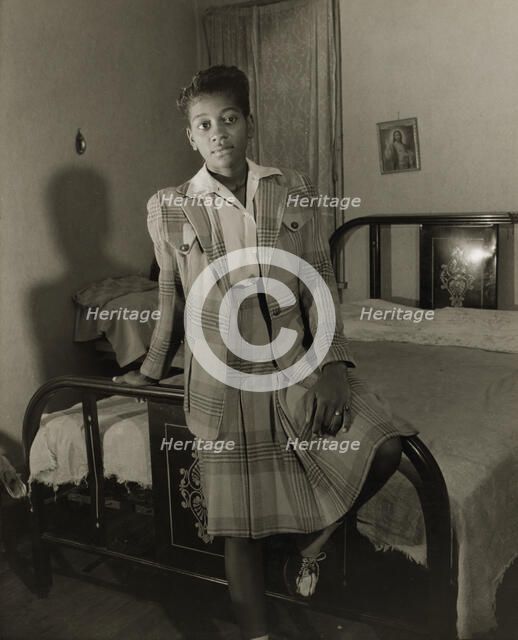 Adopted daughter of Mrs. Ella Watson, a government charwoman, Washington, D.C., 1942. Creator: Gordon Parks.