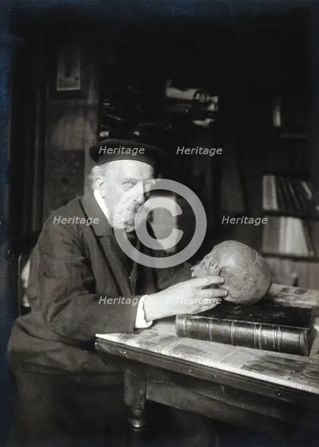 Adrien de Mortillet, holding a skull. Creator: Unknown.
