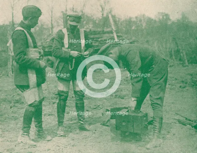 Aerial photographers fixing on parachute harnesses before making an ascent, c1917 (1919). Artist: Unknown.