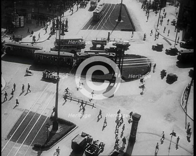 Aerial Shot of a Tram Line with People Walking Around, 1933. Creator: British Pathe Ltd.