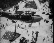 Aerial Shot of a Tram Line with People Walking Around, 1933. Creator: British Pathe Ltd
