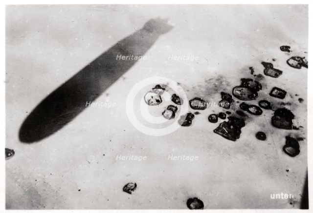 Aerial view of a desert settlement, with a shadow cast by a Zeppelin, 1931 (1933). Artist: Unknown