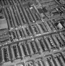 Aerial view of terraced houses, a mill and a church, Preston, Lancashire, 1971. Artist: Aerofilms