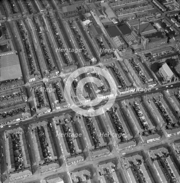 Aerial view of terraced houses, a mill and a church, Preston, Lancashire, 1971. Artist: Aerofilms.