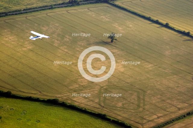 Aeroplane flying over Down Ampney, Gloucestershire, 2006. Artist: Peter Horne.
