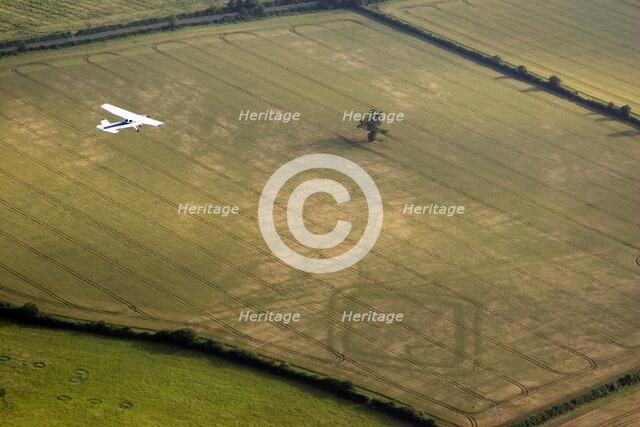 Aeroplane flying over Down Ampney, Gloucestershire, 2006. Artist: Peter Horne.