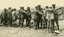 After the Battle: searching German prisoners of war... First World War, c1916, (c1920). Creator: Unknown