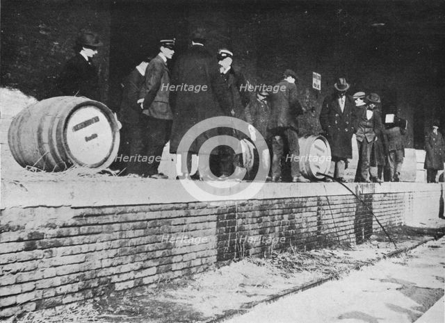 'After the Declaration of War: German beer being run away at an Italian Customs store', 1915. Artist: Unknown.