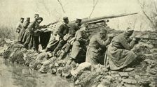 After the Rains: Serbian Infantry...during the Floods First World War, c1915, (c1920). Creator: Unknown