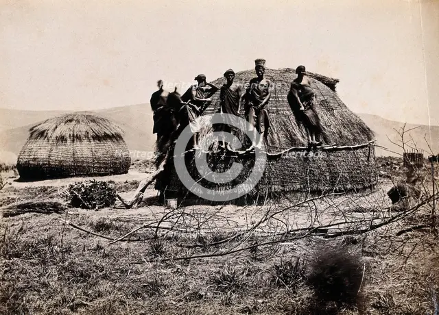 Africa: a group of African people standing on a kraal hut, between 1800 and 1899. Creator: Unknown.
