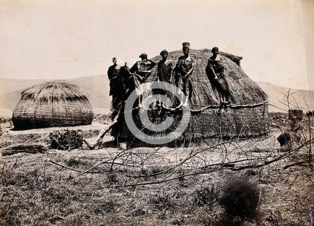 Africa: a group of African people standing on a kraal hut, between 1800 and 1899. Creator: Unknown.