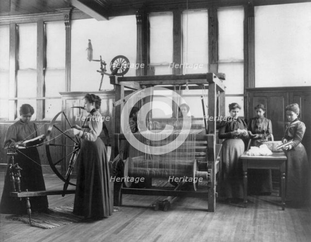 African-American women weaving rug in home economics class at Hampton Institute, Va., 1899 or 1900. Creator: Frances Benjamin Johnston.