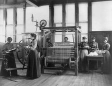 African-American women weaving rug in home economics class at Hampton Institute, Va., 1899 or 1900. Creator: Frances Benjamin Johnston