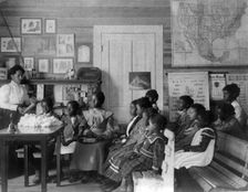 African American children and teacher in classroom studying..., Annie Davis School...Alabama, c1902. Creator: Frances Benjamin Johnston